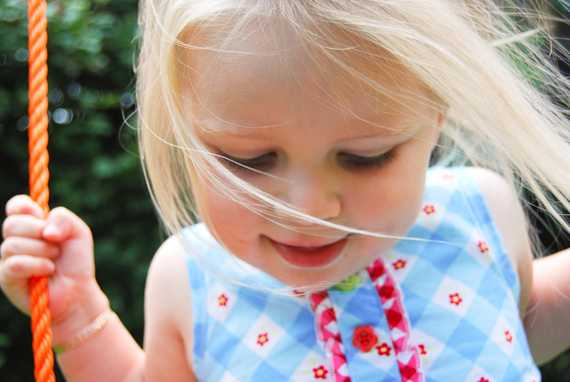 Ava on her swing